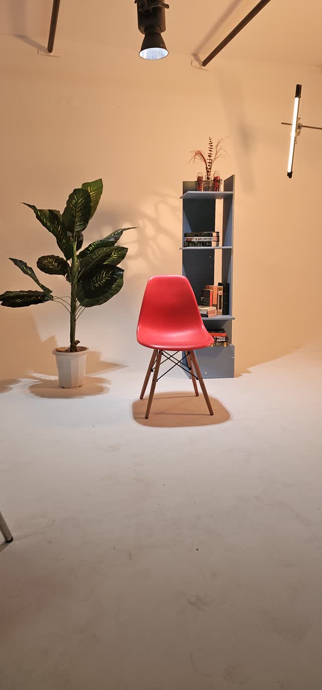 Red chair on white cyc