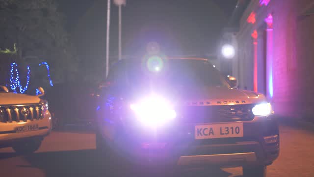Range Rover in purple night light