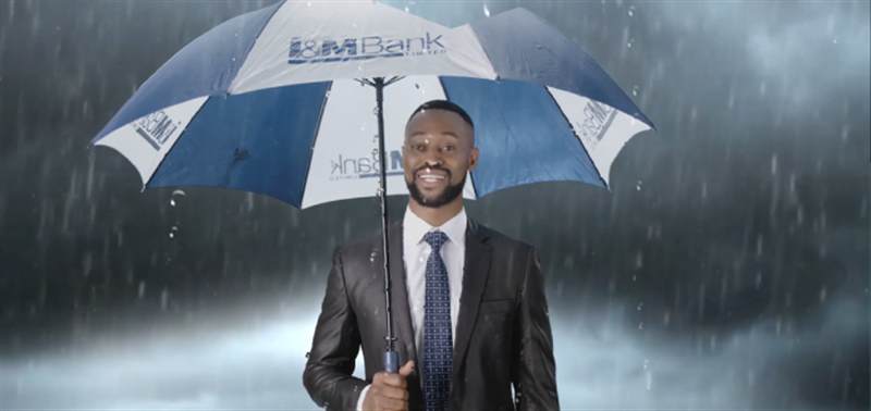 I&M Bank commercial &mdash; man with umbrella in rain